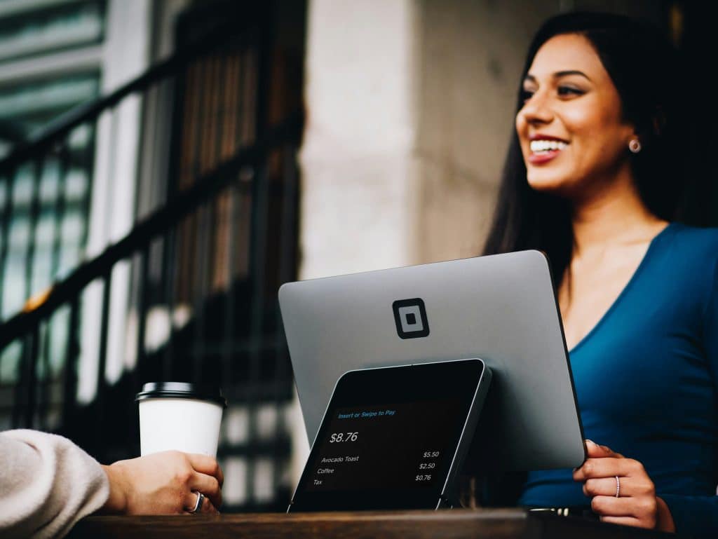 Woman checking in for an online restaurant order