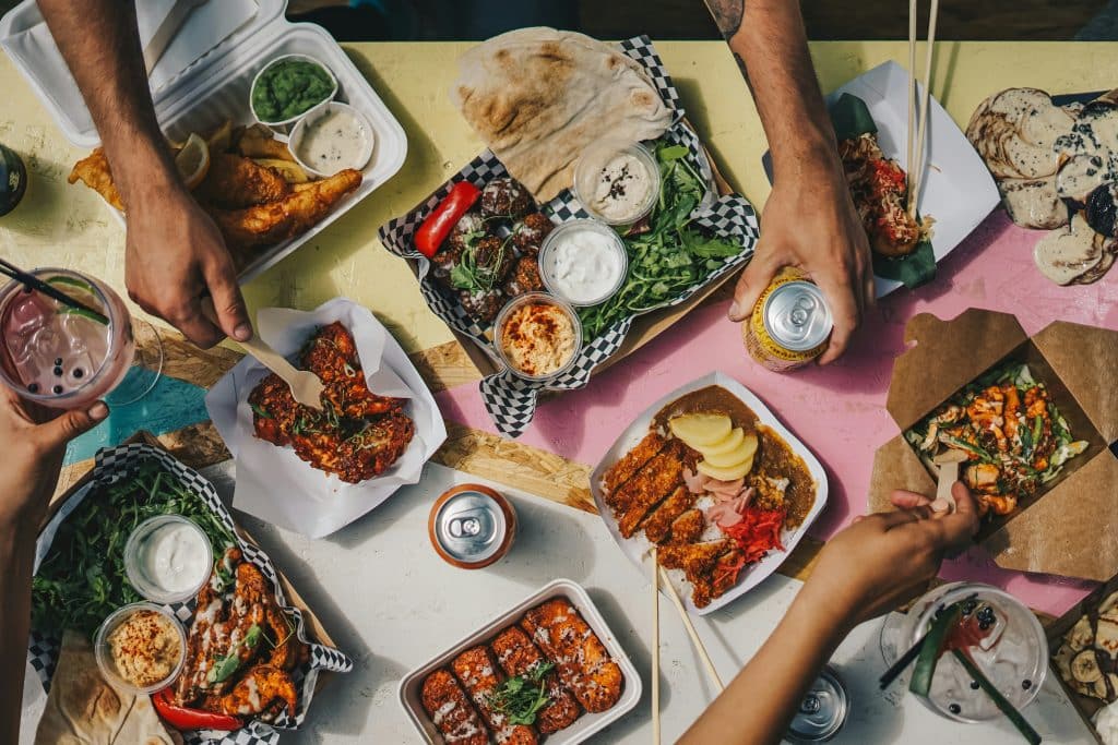 Full table of takeout food from a restaurant